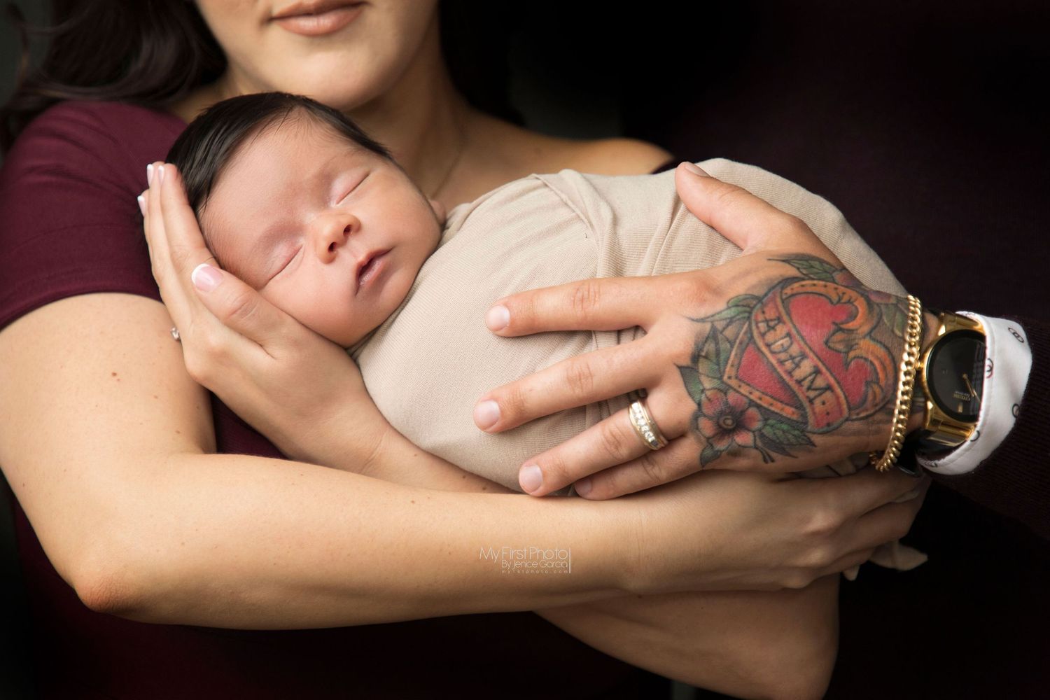 A series of close-up photos showing hands holding a sleeping newborn baby in soft lighting.