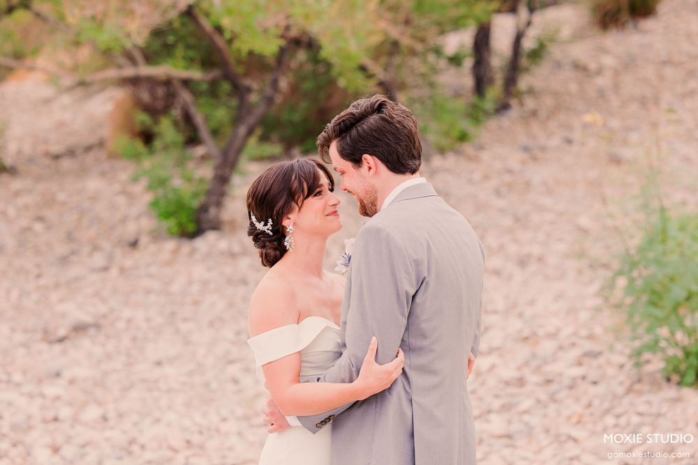 A romantic sequence of wedding photos showing a couple sharing intimate moments in a desert landscape.