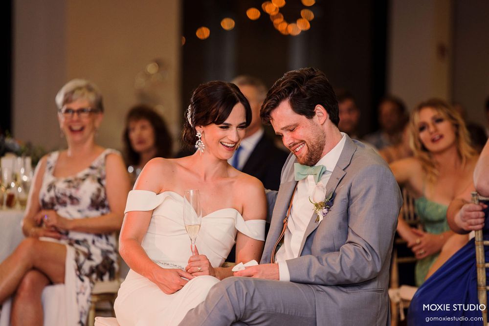 A wedding reception dance floor shows couples dancing together during an evening celebration.