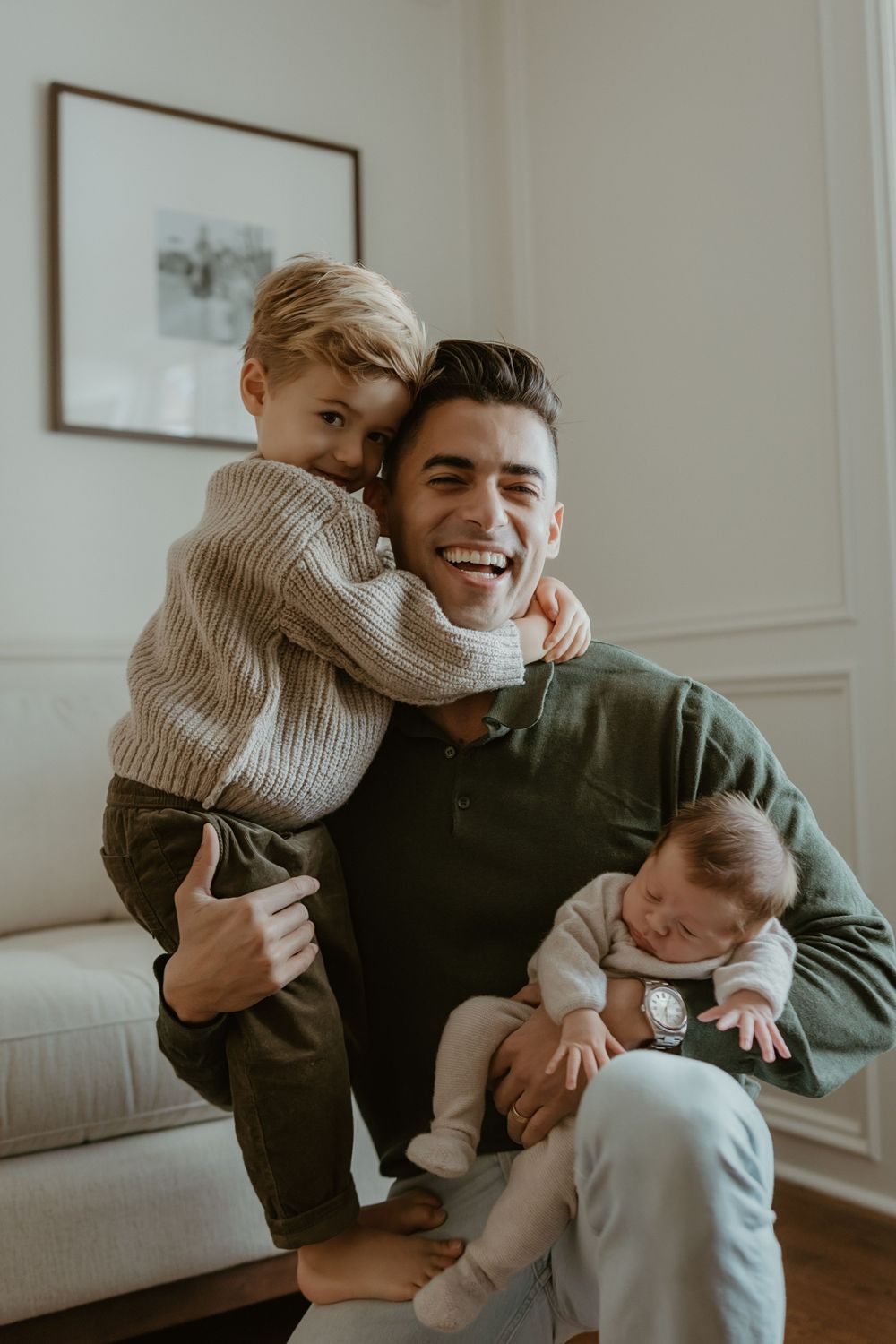 Candid family photography series showing joyful playtime and laughter on a hardwood floor.