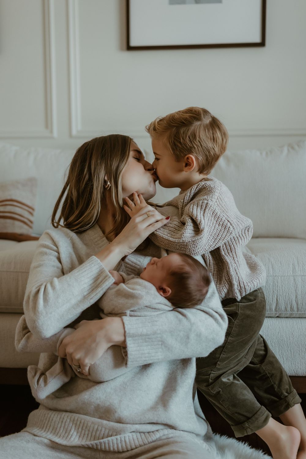 Family lifestyle photography series showing intimate moments of connection on a white couch.