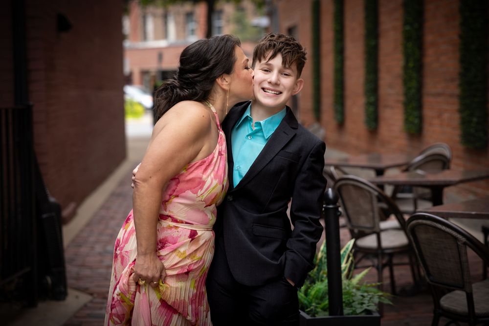 Romantic outdoor portraits near brick architecture and benches.