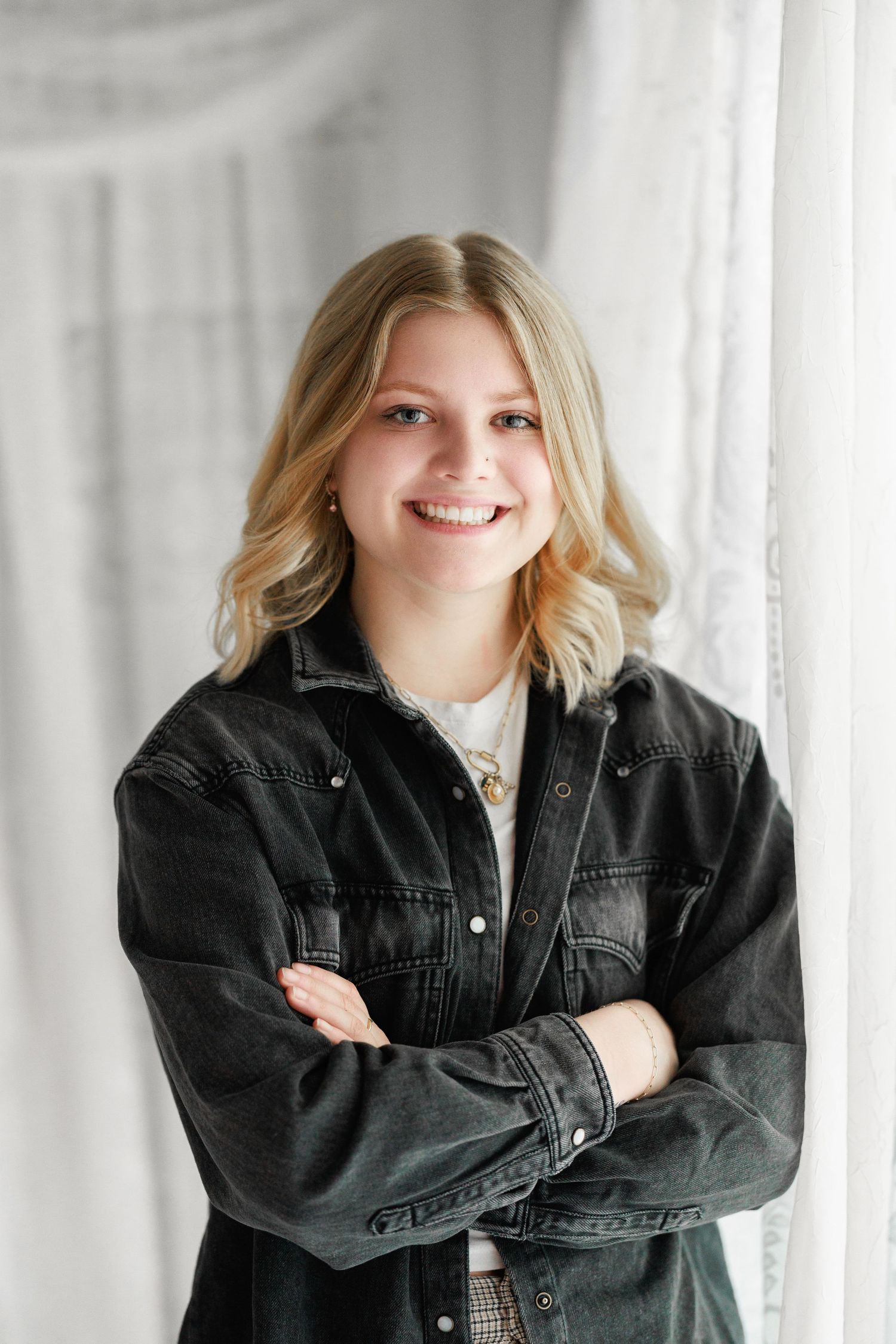 A series of three photos showing someone in a black denim jacket against a white background with natural lighting.