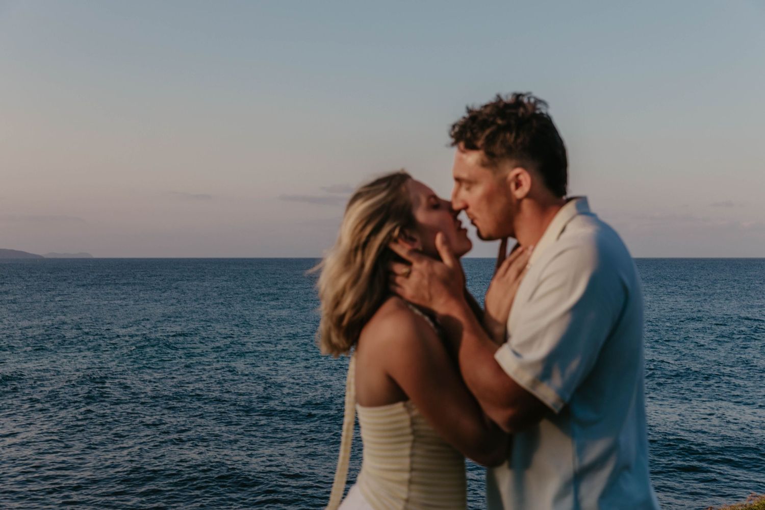 Happily engaged sunset over the ocean, Australia