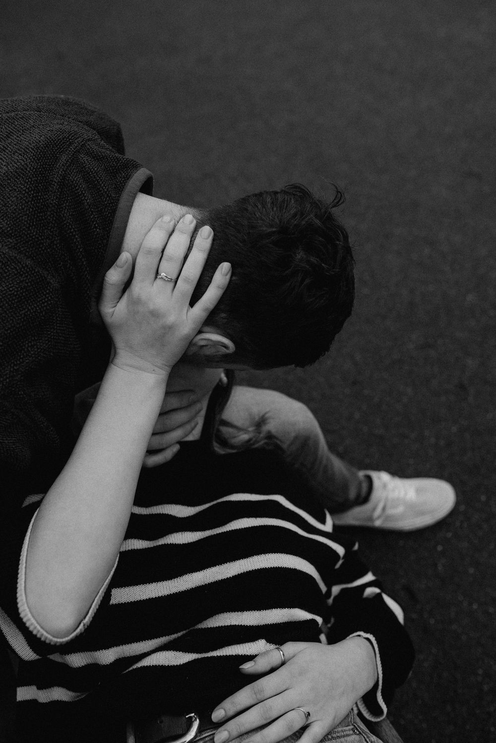 A black and white photo sequence showing someone in a striped shirt running their hands through their hair.