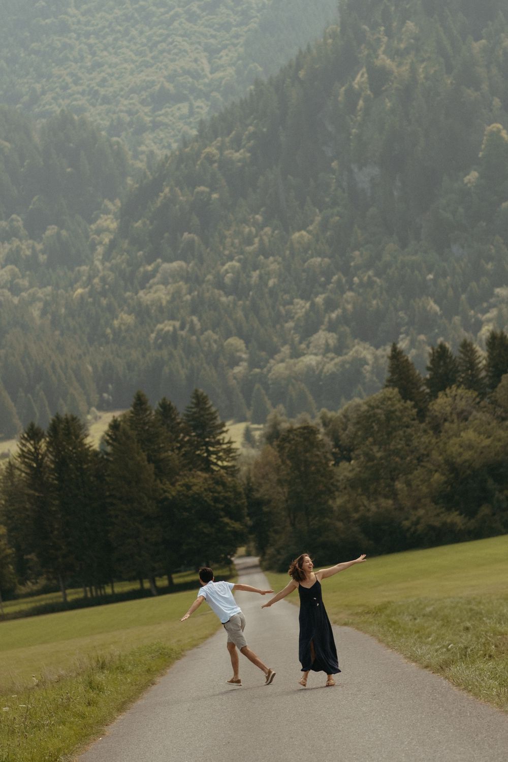 International couple having a great time in Bavaria with arms wide open
