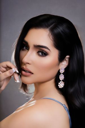 Glamour portrait featuring sparkling chandelier earrings and elegant makeup. Photographer Jose JONAV Navarro at Miami Florida