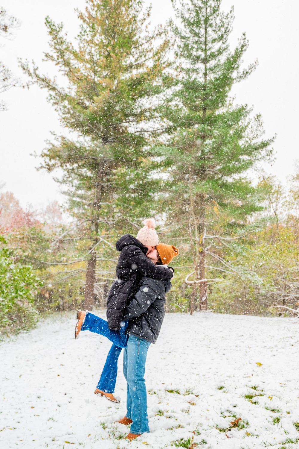A romantic winter photoshoot sequence with evergreen trees and snow-covered ground.