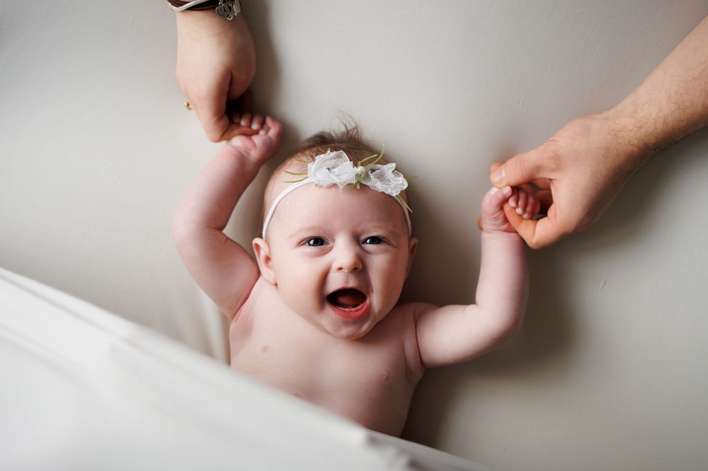 newborn baby girl 3 months old mummy and daddy smiling Greater Manchester Tameside