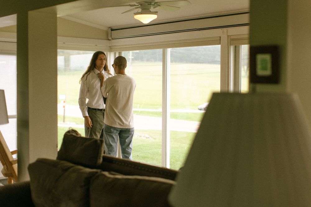 Interior view of modern reception space with large windows and natural lighting.