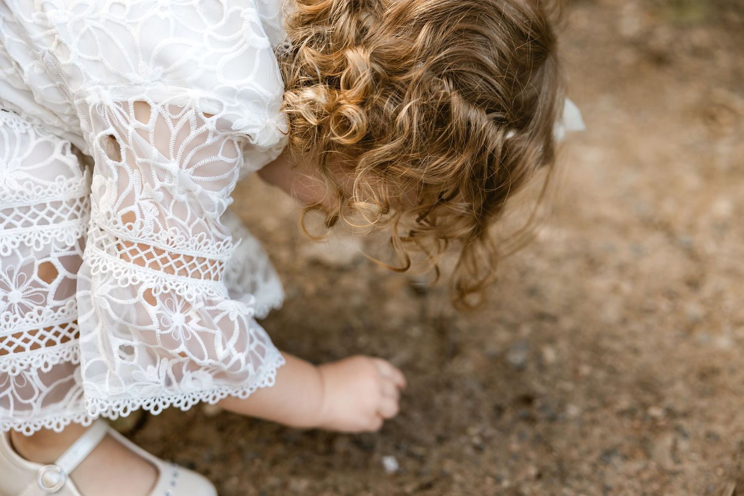 Young indian girl dressed in a white outfit for her family portrait