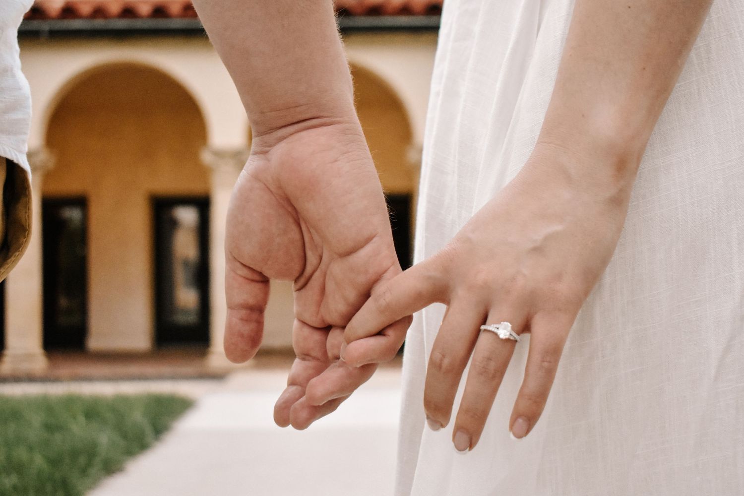 kc engagement shoot, man and woman hands pinkies linked with ring