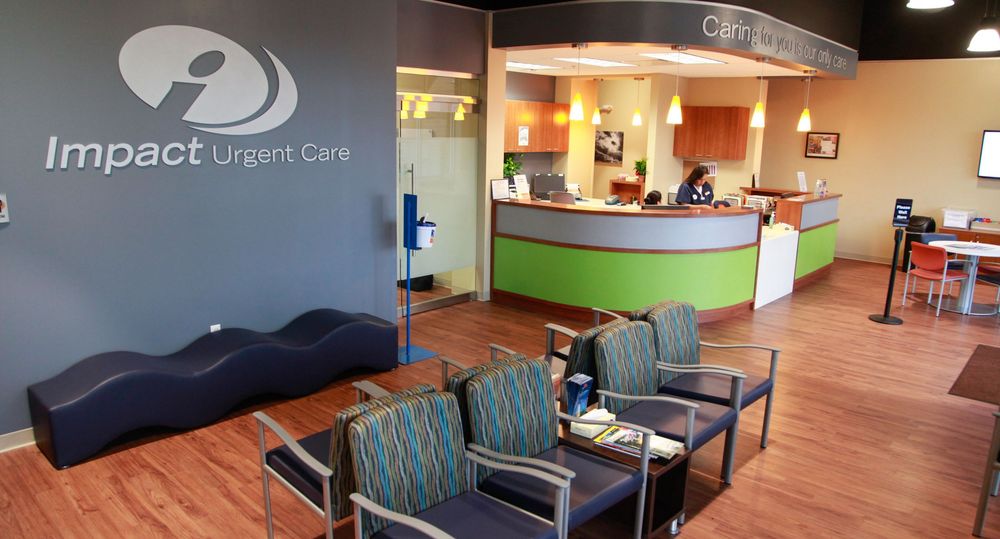 Reception area of medical office with comfortable seating and hardwood floors.