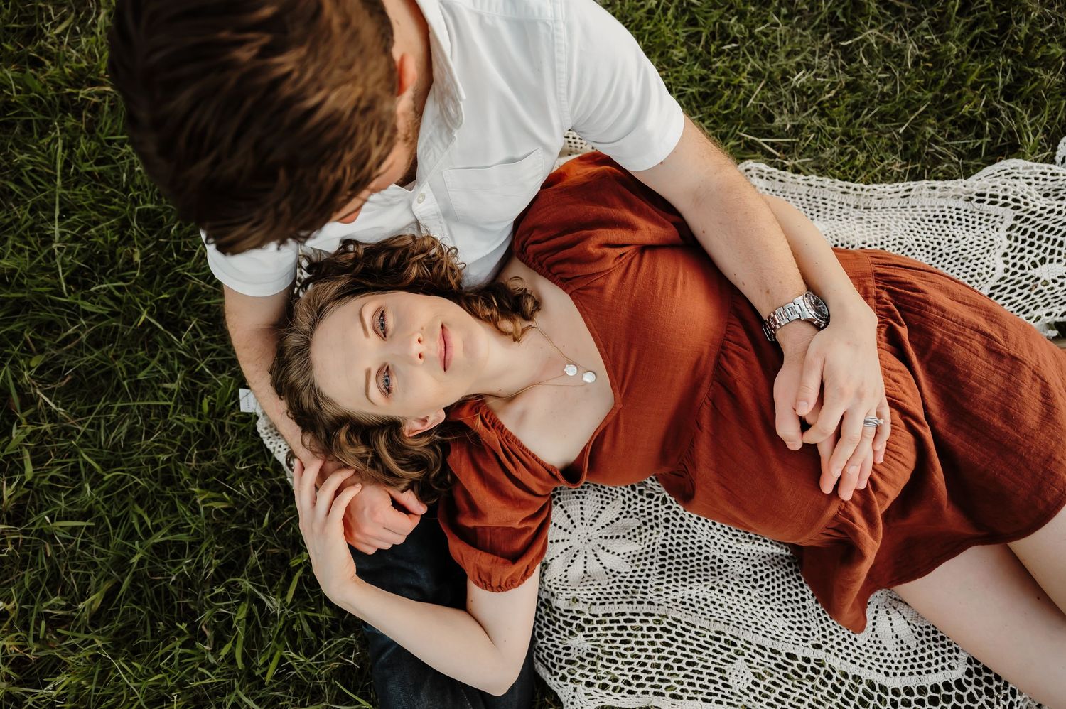 Couple kisses by a river