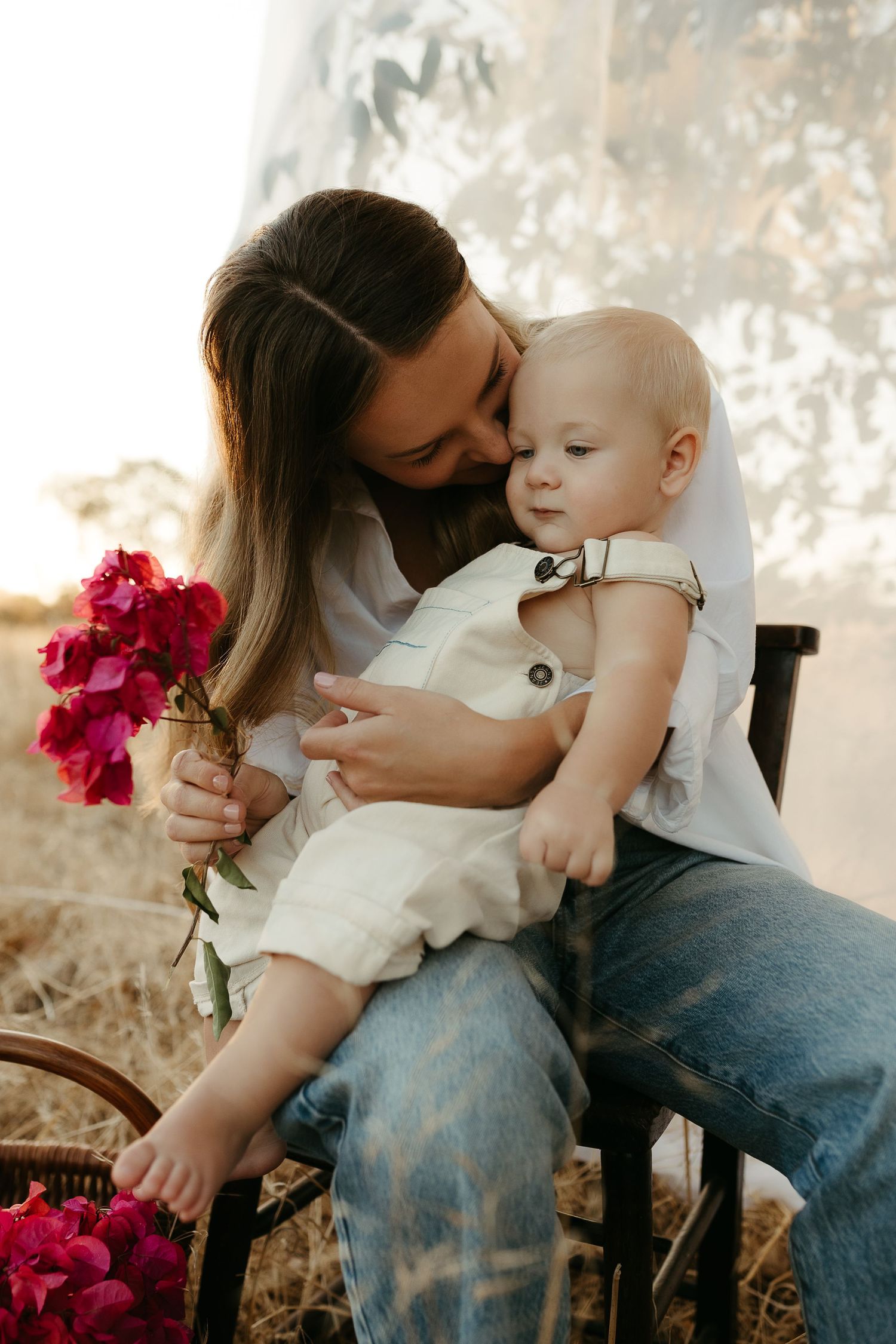 A mother standing while breastfeeding her baby daughter