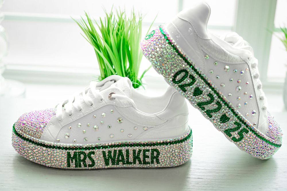 White Nike sneakers with custom green graffiti-style artwork and paint splatters displayed in multiple angles.
