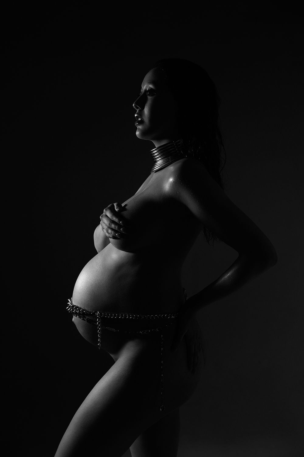 Dramatic low-key black and white silhouette photography with moody lighting.