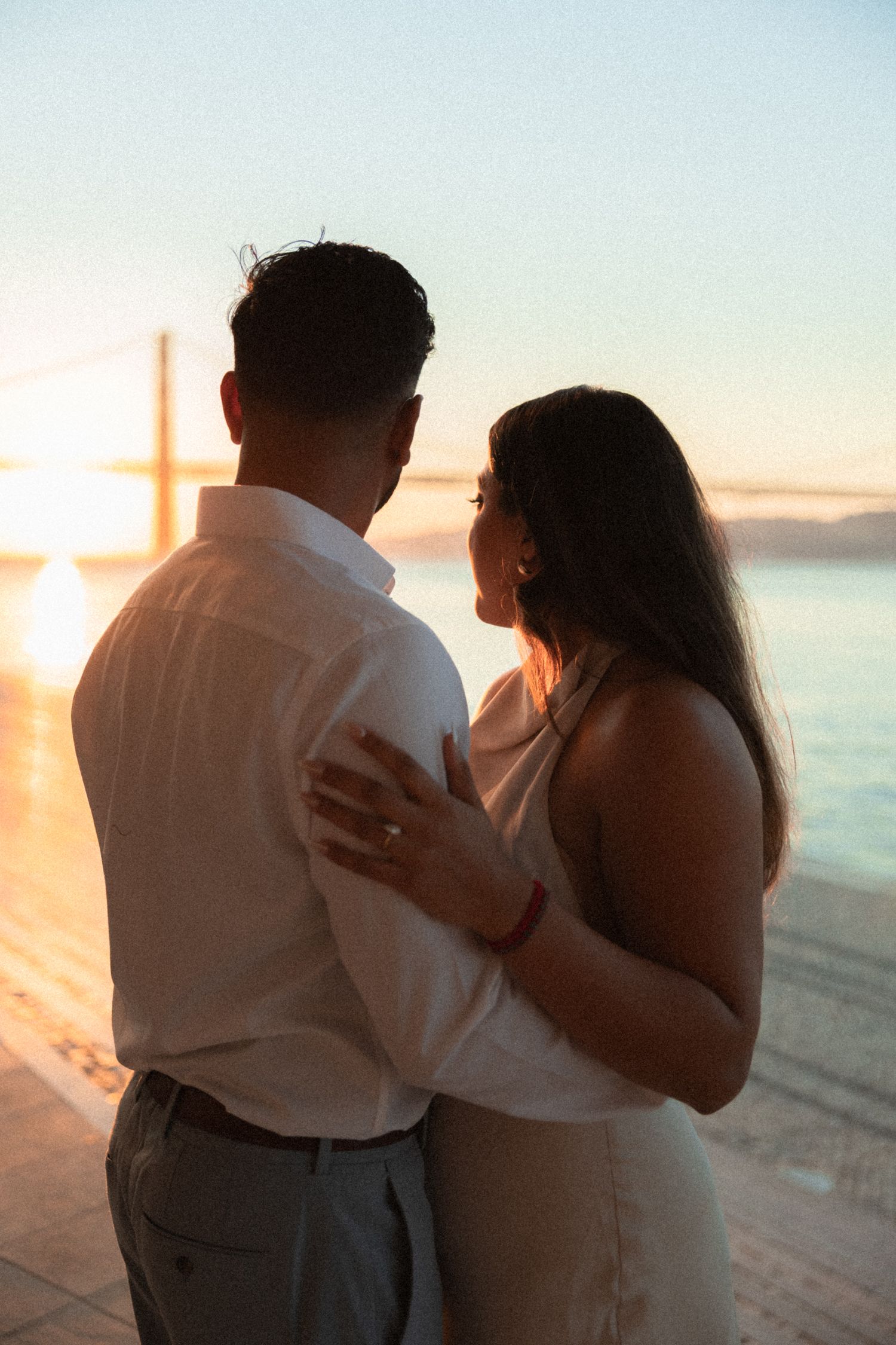 Romantic close-up during engagement session at sunrise in Lisbon — natural light and emotional storytelling photography.