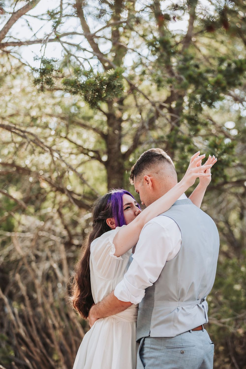 A romantic outdoor wedding moment captured in a series of three photos showing a couple embracing under sunlit trees.