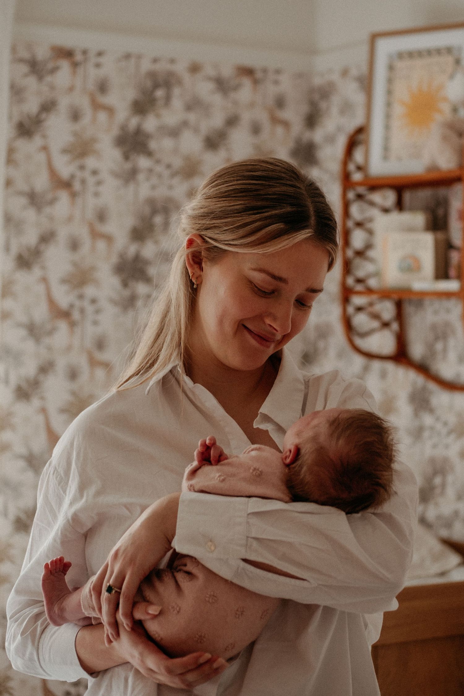 A new mother gazing at her baby in her arms