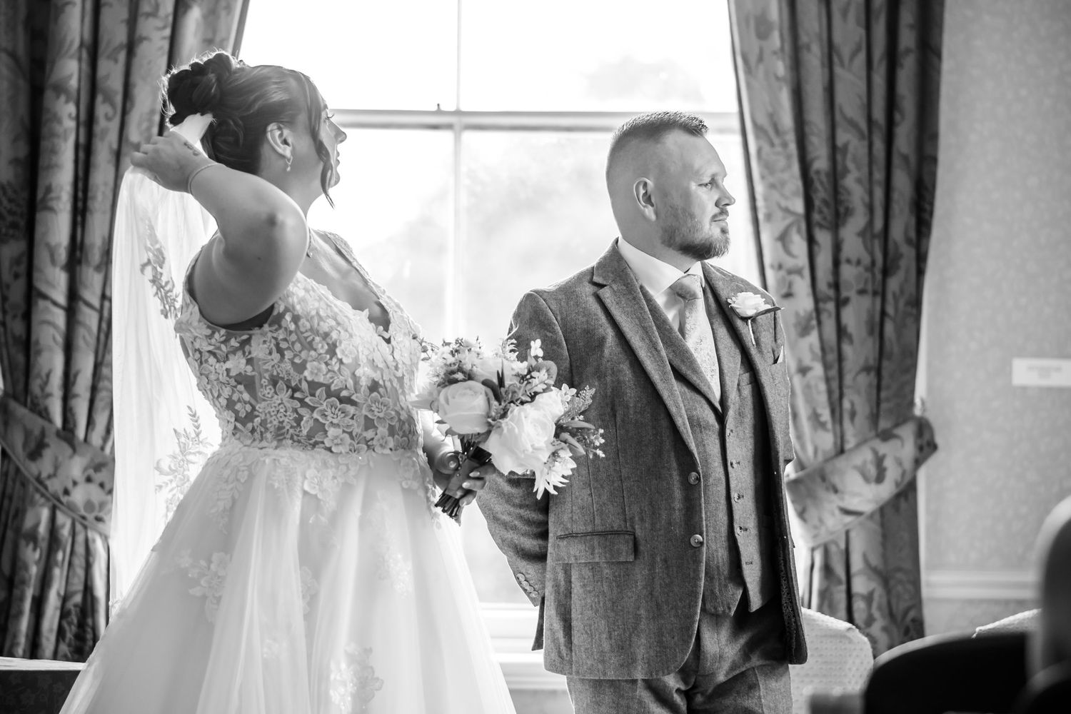 Candid wedding ceremony photograph in black and white at Runcorn Town Hall by Cheshire wedding photographer Michael Pardoe