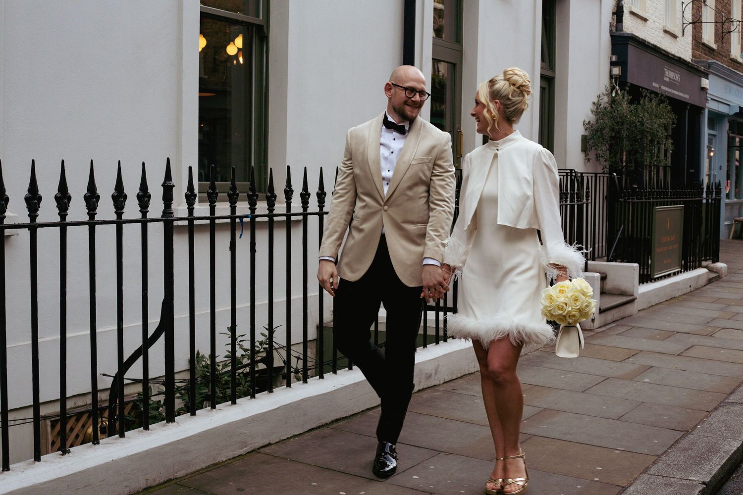 Newlyweds walking through London streets after their ceremony at Old Marylebone Town Hall — natural and editorial wedding photography