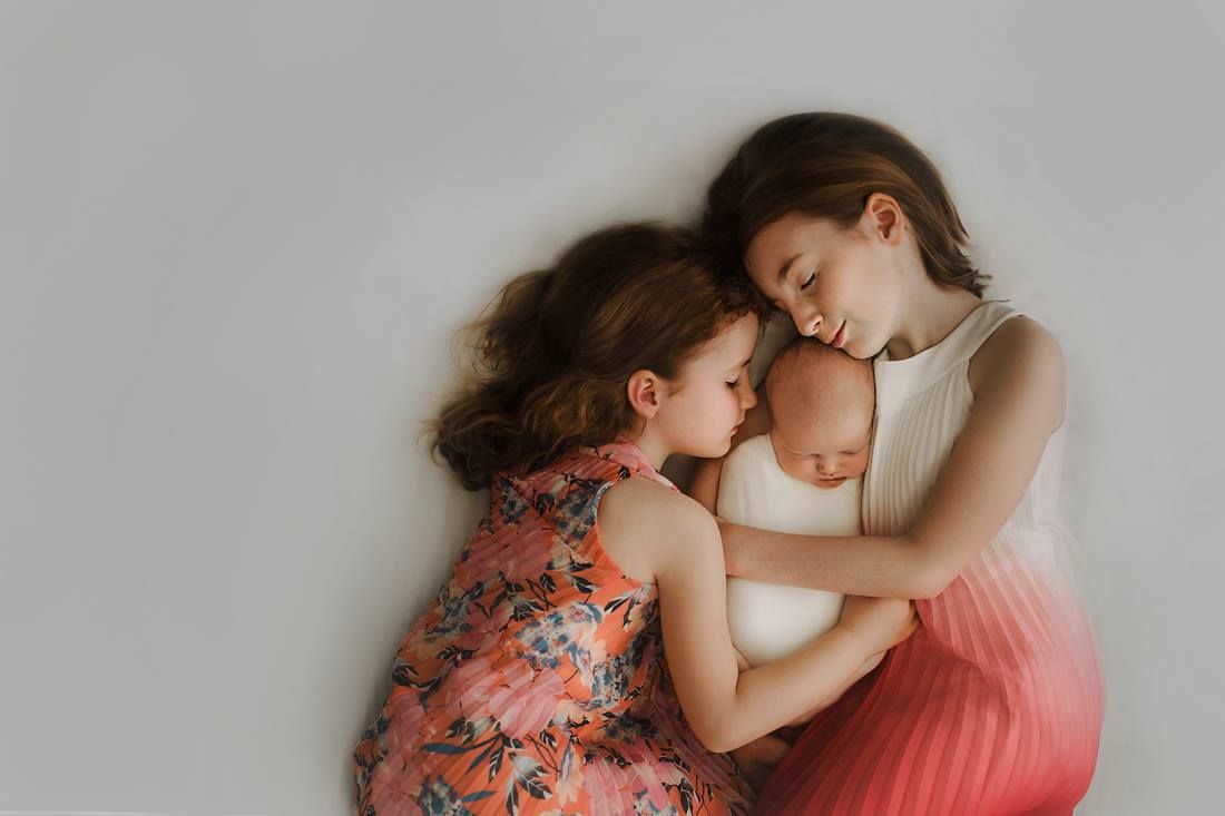 Tender family moment during newborn session in Springfield MO.
