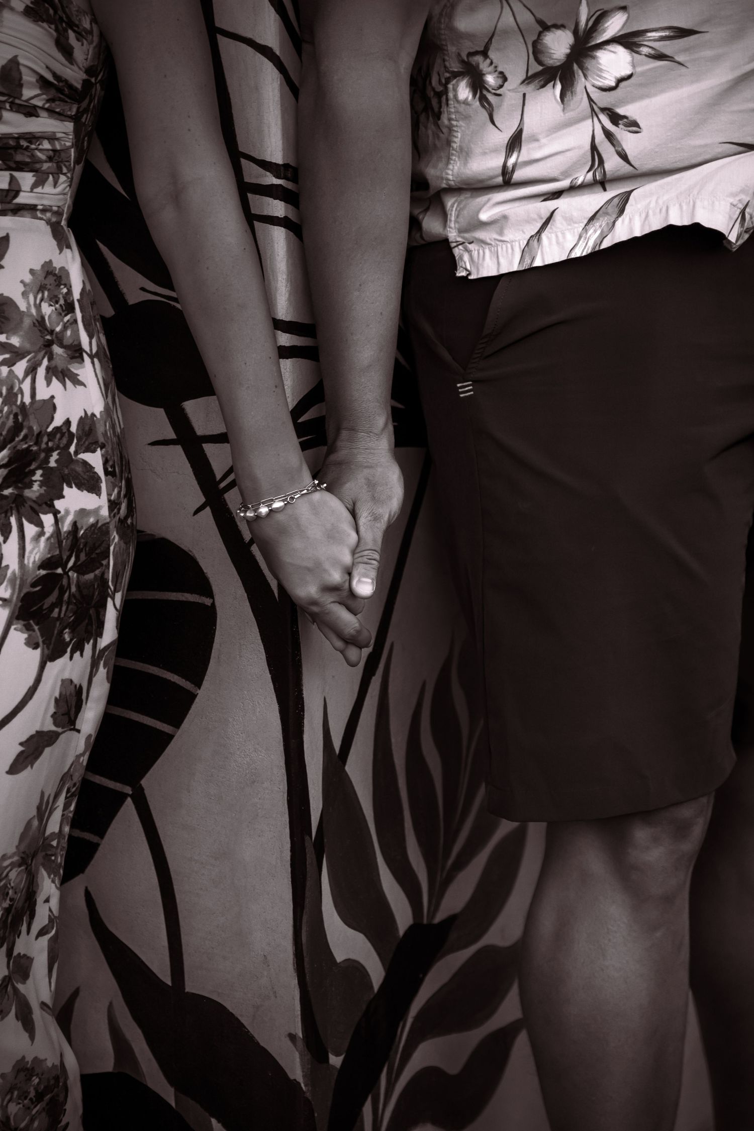 Black and white artistic detail shots of formal wear and accessories.