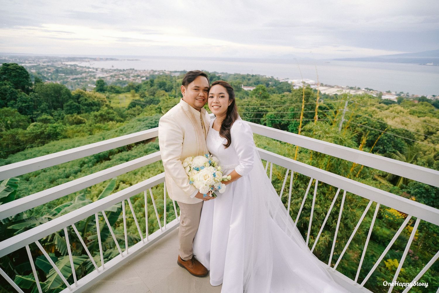 Bride and groom, Wilson and Lotlot, celebrating their joyful wedding at Station 5 Malasag in Cagayan de Oro City surrounded by loved ones.