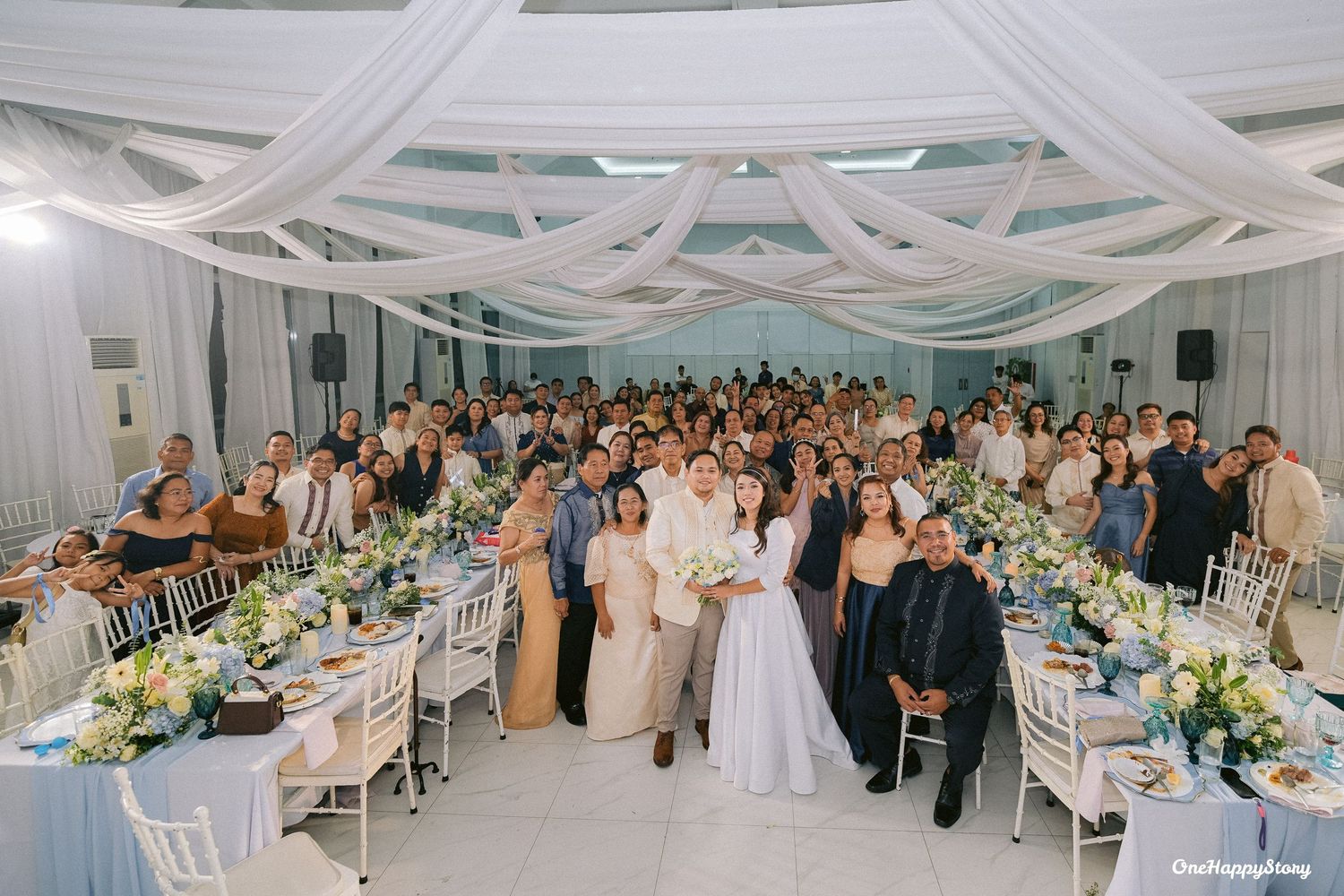 Bride and groom, Wilson and Lotlot, celebrating their joyful wedding at Station 5 Malasag in Cagayan de Oro City surrounded by loved ones.
