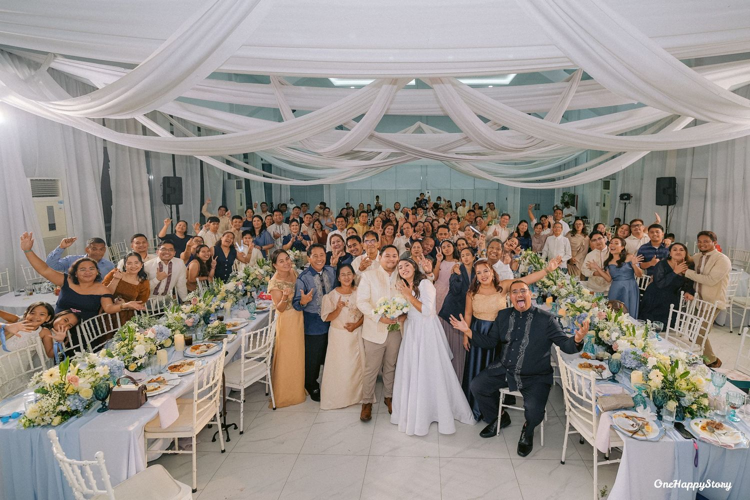 Bride and groom, Wilson and Lotlot, celebrating their joyful wedding at Station 5 Malasag in Cagayan de Oro City surrounded by loved ones.