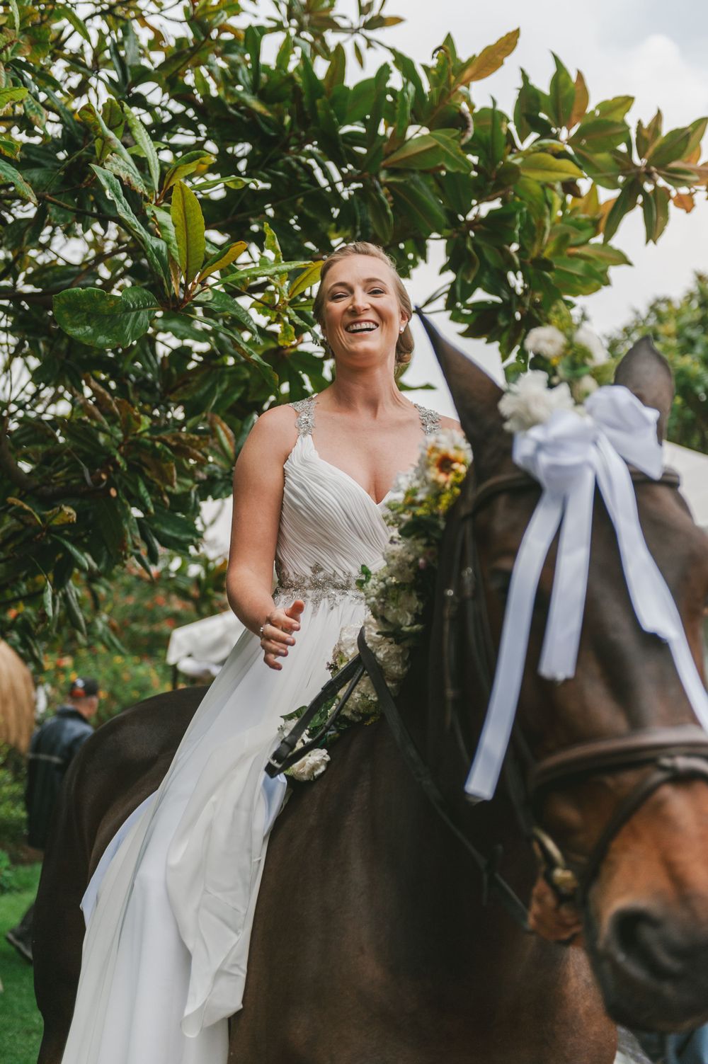 Bride arrives at her wedding ceremony riding a horse in Colombia.