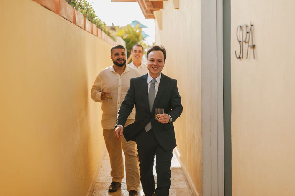 Groom happily walking to his wedding ceremony.