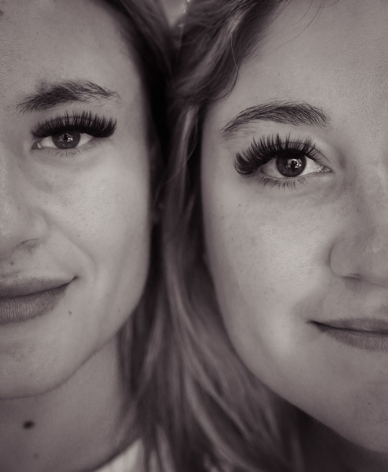 Black and white close-up portrait with artistic composition.