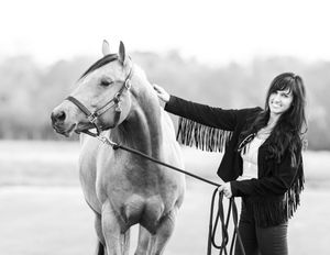 Black and white series showing interaction between horse and rider in artistic composition.
