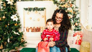 Christmas themed family photoshoot with decorated tree and festive decor.