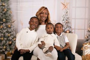 Holiday portrait session with family members in coordinated white and cream outfits.