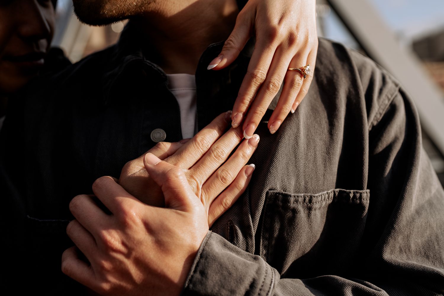 Close-up of hands touching intimately showing engagement or wedding ring taken by Melbourne casual couples and engagement photographer
