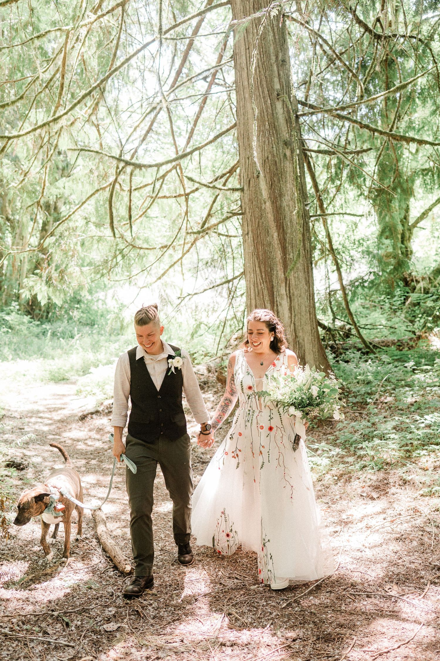 two brides walking hand in hand. Photo by Sequim Elopement Photographer, Pine + Vow