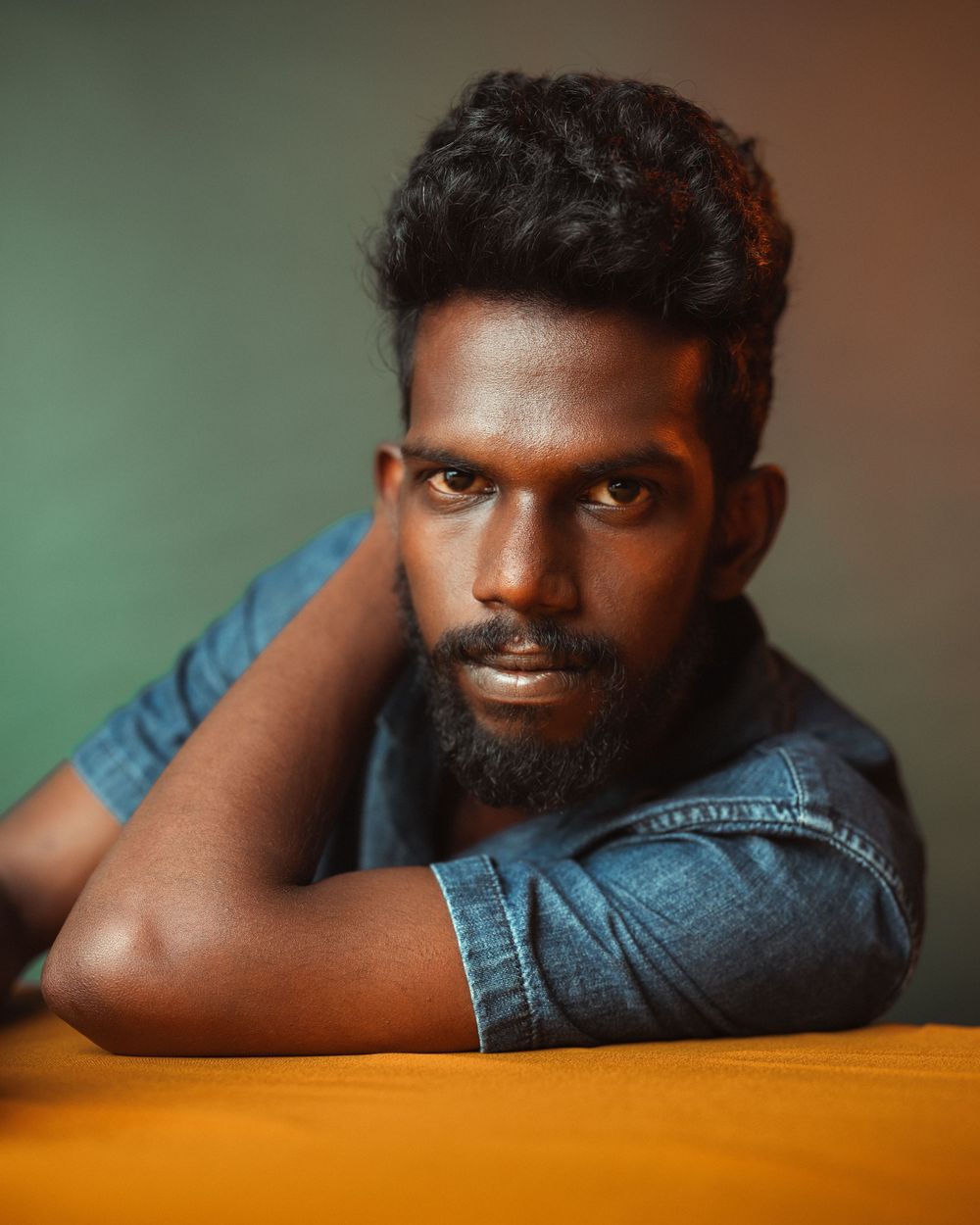 Portrait sequence showing a person resting on an orange surface with changing expressions.