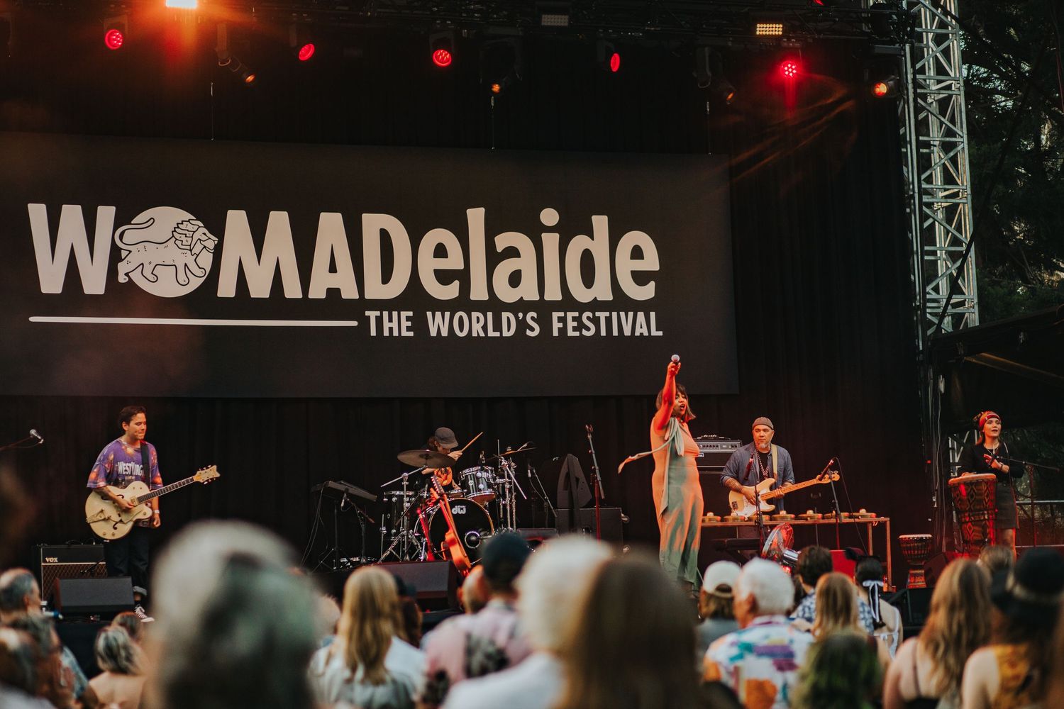 Live band performing on stage at WOMADelaide The World Festival outdoor concert.
