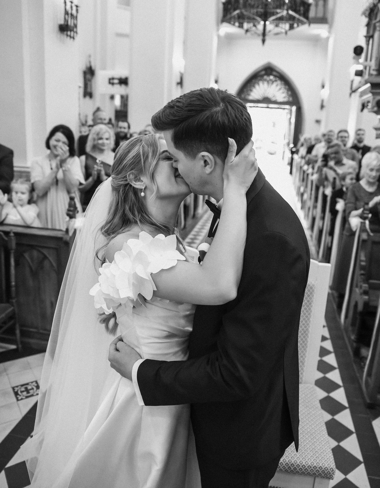 Elegant wedding ceremony photos showing couples dancing in a grand church setting.