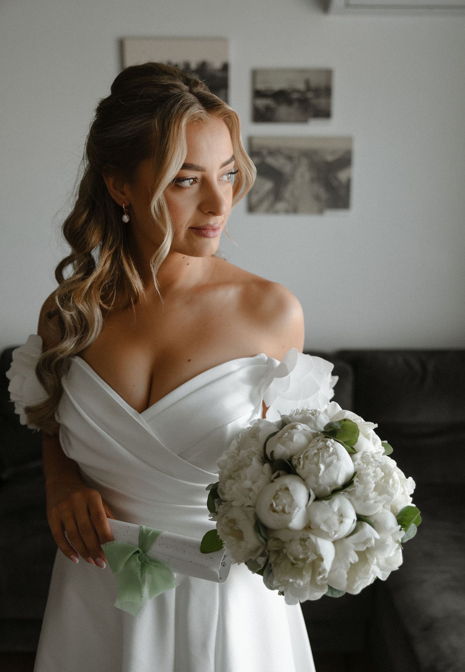 A series of elegant bridal portraits showing a white wedding dress and a luxurious bouquet of white peonies.