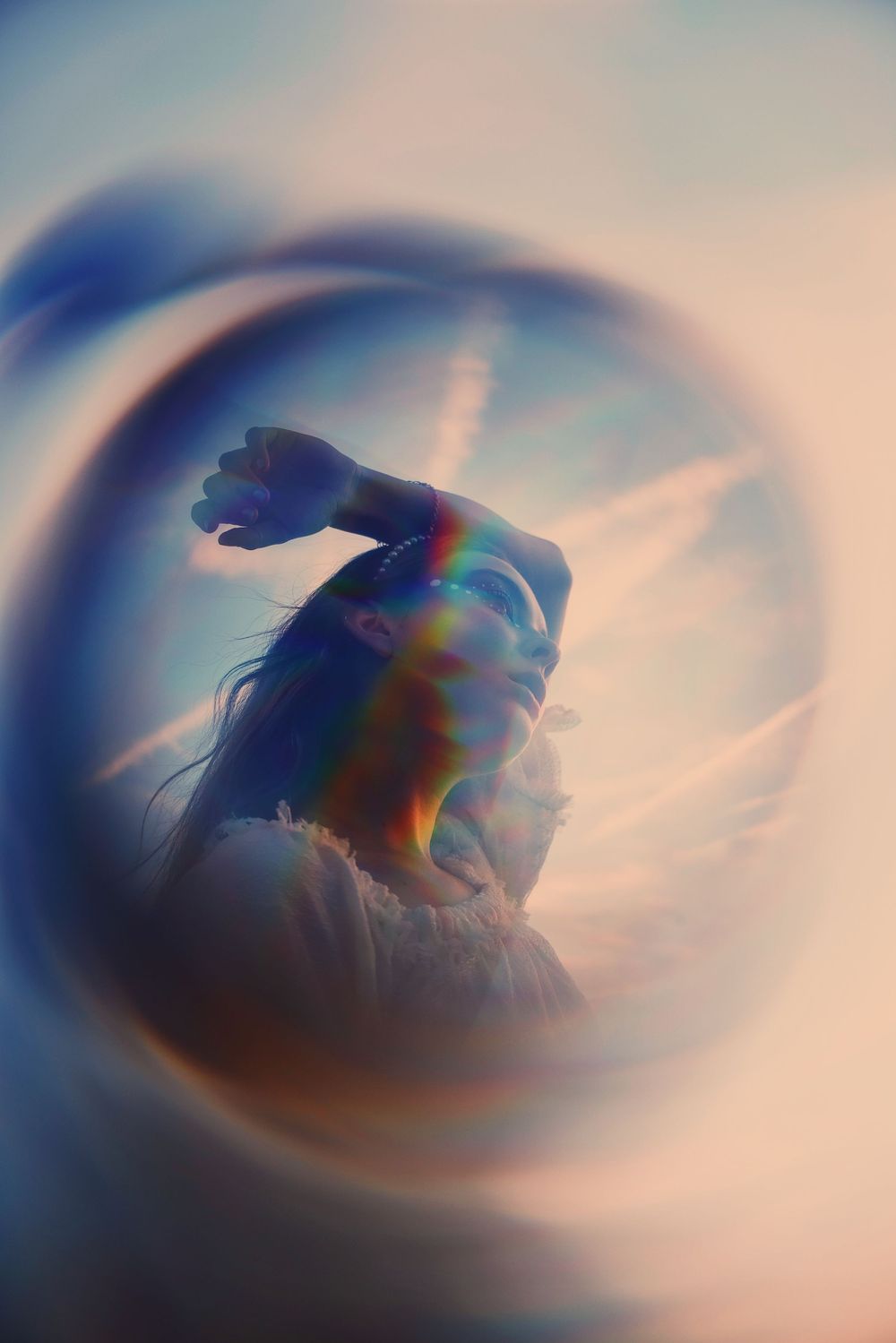 Abstract blurred sequence showing motion and color transitions across multiple frames in soft pastel tones.