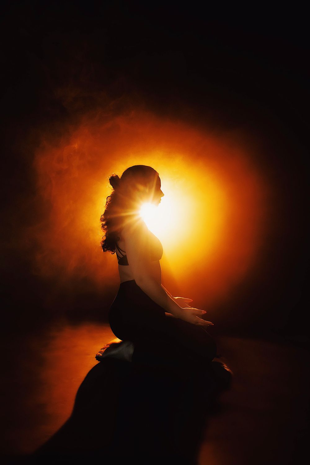 A silhouetted figure is dramatically backlit against a glowing orange sunset creating a striking artistic sequence.