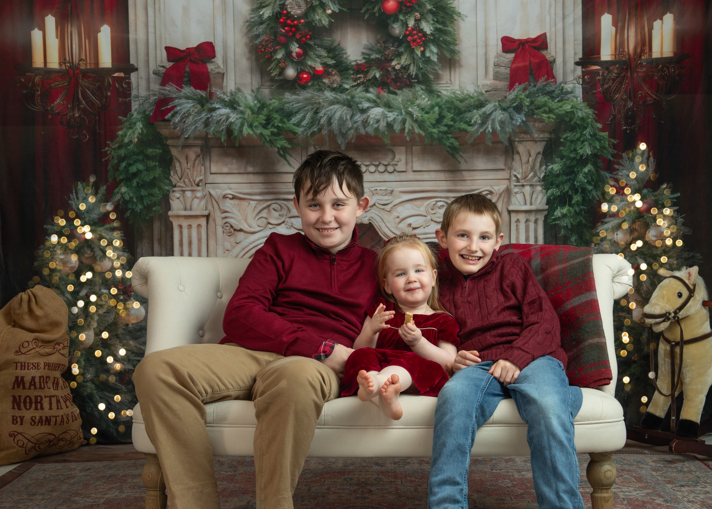 A festive Christmas photo collage showing people sitting on a tan couch with holiday decorations and greenery in the background.