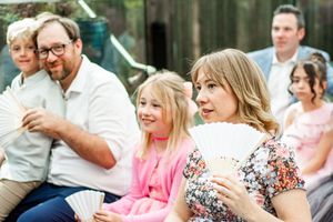 Wedding guests gathered outdoors for a celebration event.