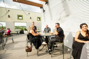 Modern indoor venue with minimalist seating arrangements and white walls.