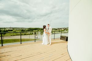 Panoramic view of a waterfront wedding venue with scenic landscape.