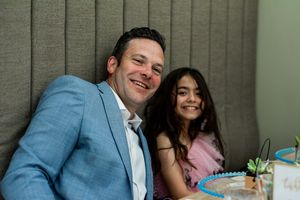 Couple sharing intimate moments during wedding reception.